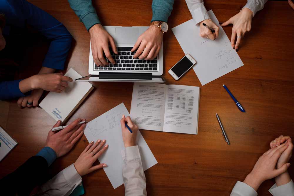 capture of the table from the top with a team meeting